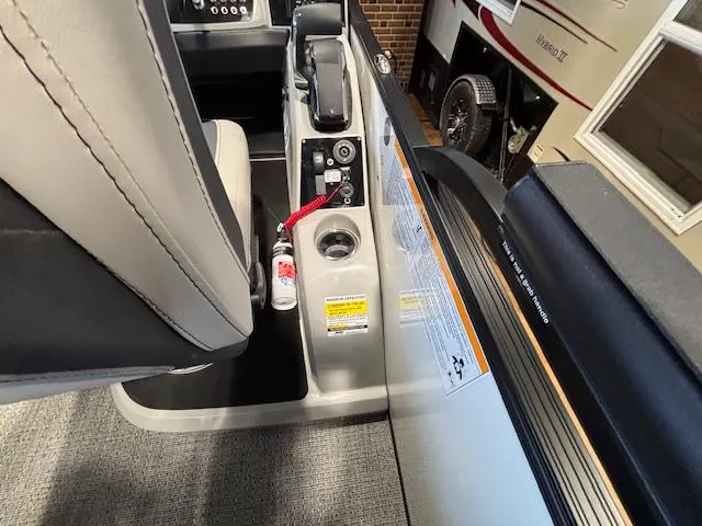 Slide: The Image of Interior view of 2025 Barletta Cabrio 22M boat, featuring seating and control panel. - 19