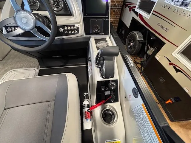 Slide: The Image of Interior view of 2025 Barletta Cabrio 22M boat cockpit with steering wheel and controls. - 20