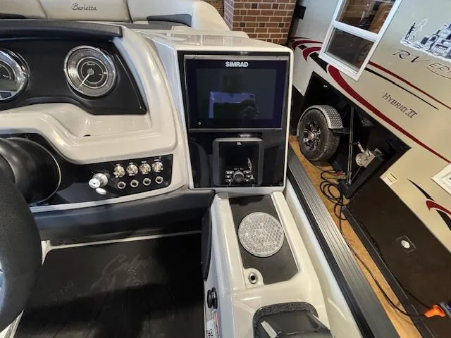 Slide: The Image of Dashboard of 2025 Barletta Cabrio 22M boat with Simrad display and controls. - 21