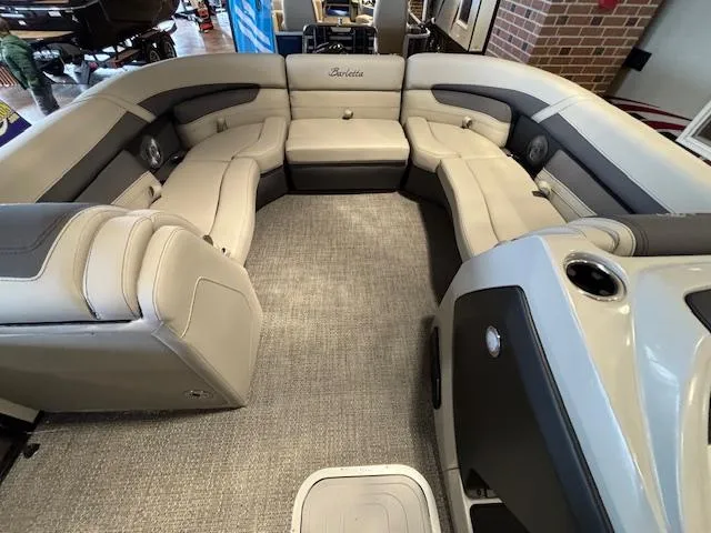 Slide: The Image of 2025 Barletta Cabrio 22M pontoon boat interior with luxurious seating and modern design. - 26
