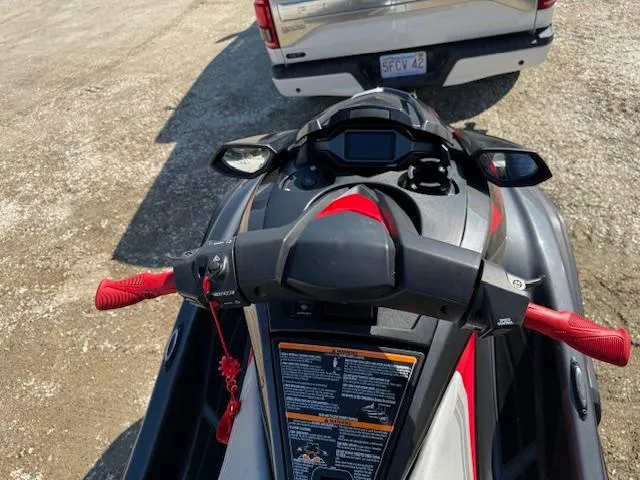 Slide: The Image of 2019 Yamaha WaveRunner SVHO with red accents, parked behind a white vehicle. - 12