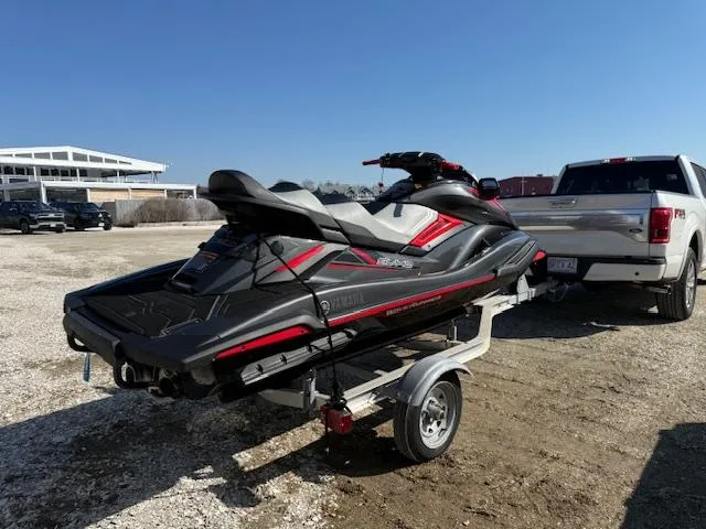 Slide: The Image of 2019 Yamaha WaveRunner SVHO on trailer, parked beside a white truck under clear blue sky. - 13