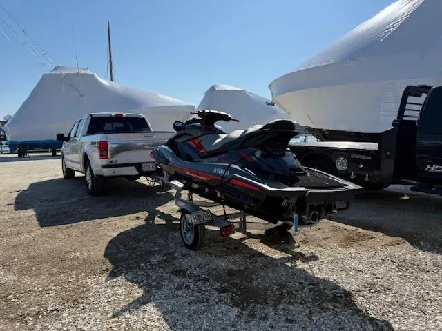 Slide: The Image of 2019 Yamaha WaveRunner SVHO on trailer, parked near trucks and covered boats. - 14
