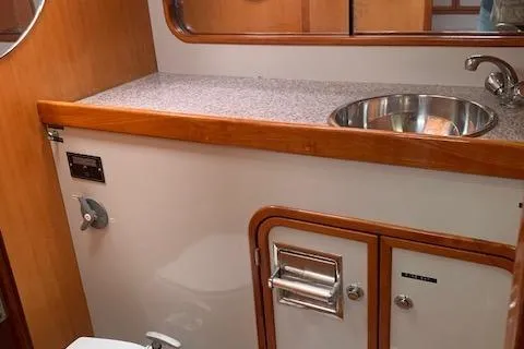 Slide: The Image of Bathroom interior of 1996 Santa Cruz 52 yacht with sink and storage. - 21