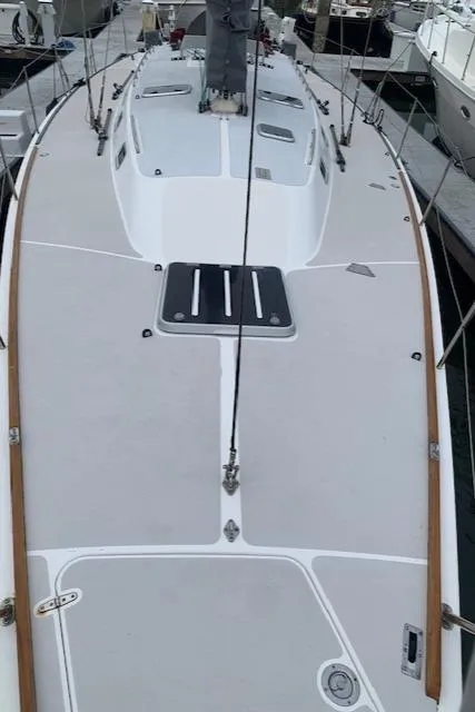 Slide: The Image of Sleek 1996 Santa Cruz 52 sailboat deck, featuring clean lines and modern design. - 26