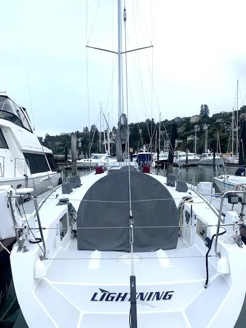 Slide: The Image of Sailboat docked in marina, Santa Cruz 52, 1996 model, named "Lightning." - 3