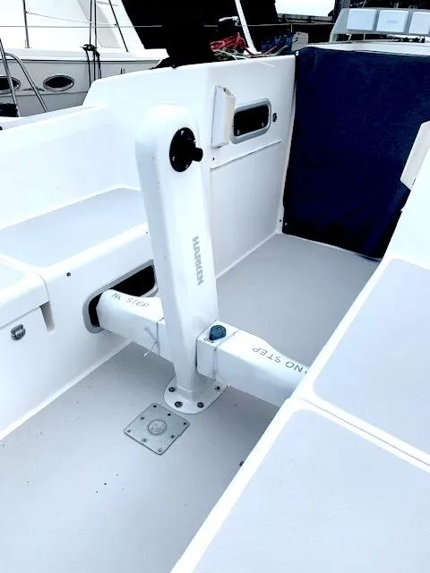 Slide: The Image of Cockpit of 1996 Santa Cruz 52 sailboat with white interior and seating. - 5