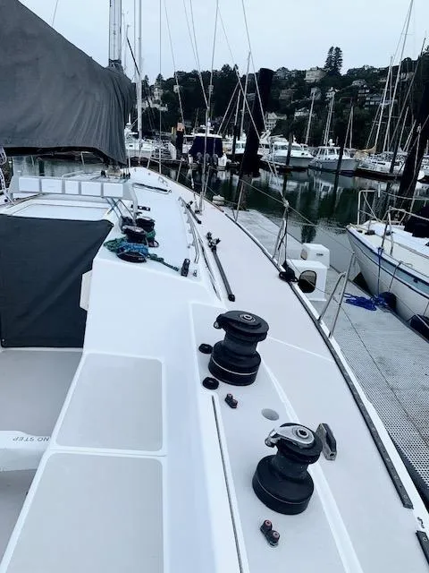 Slide: The Image of Sailboat docked at marina, Santa Cruz 52, 1996 model, with visible winches and deck. - 7