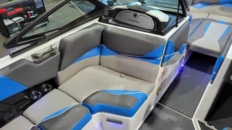 Slide: The Image of 2018 Supra SL 450 boat interior with blue and gray seating, modern design. - 11