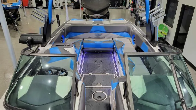 Slide: The Image of 2018 Supra SL 450 boat interior with blue accents and modern design. - 14