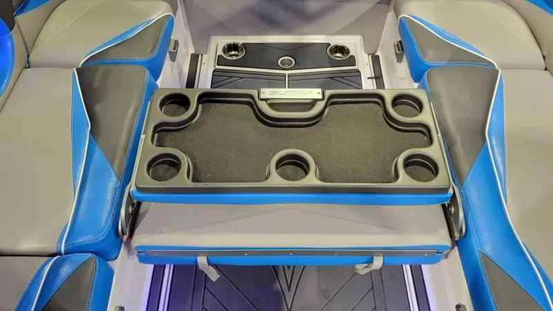 Slide: The Image of 2018 Supra SL 450 interior with blue and gray seating and cup holders. - 9