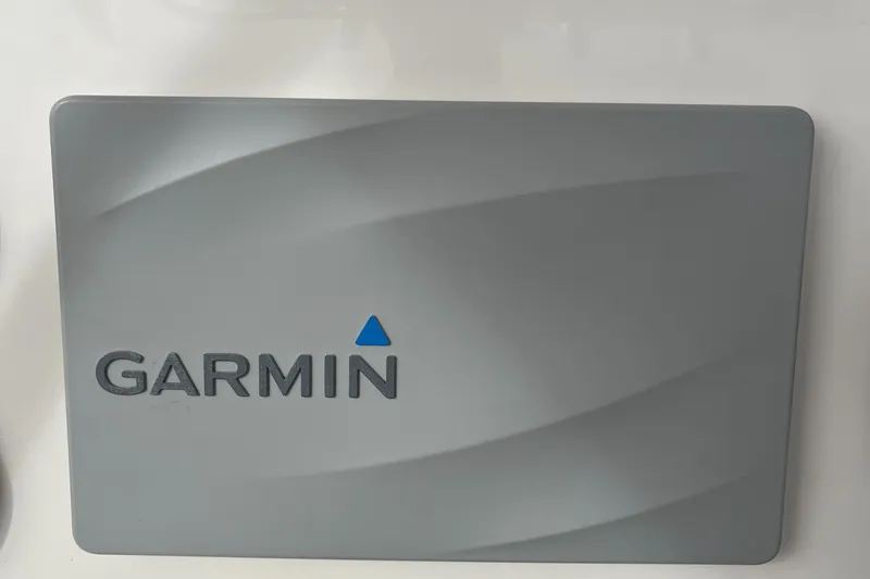 Slide: The Image of Garmin device on 2012 Cobia 237CC boat dashboard. - 23