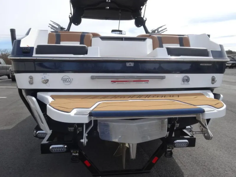 Slide: The Image of 2025 Malibu 24 MXZ boat, rear view, featuring sleek design and modern amenities. - 3
