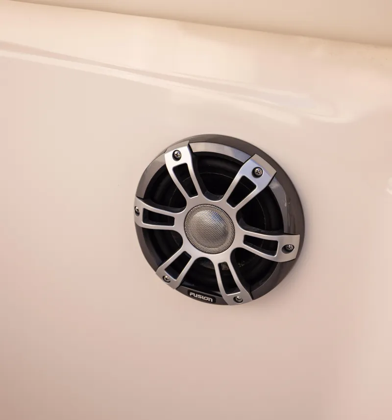 Slide: The Image of 2022 Grady-White 30.6 Canyon boat speaker detail, featuring a sleek Fusion design. - 21