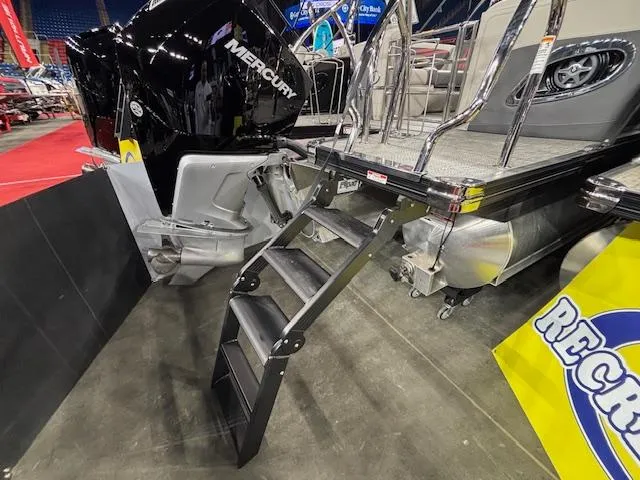 Slide: The Image of 2025 Barletta CORSA 23QC boat with Mercury engine and boarding ladder. - 13