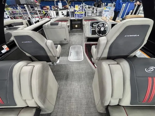 Slide: The Image of 2025 Barletta CORSA 23QC boat interior with luxurious seating and modern dashboard. - 19