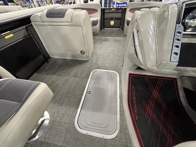 Slide: The Image of 2025 Barletta CORSA 23QC interior with gray seating and carpeted flooring. - 24
