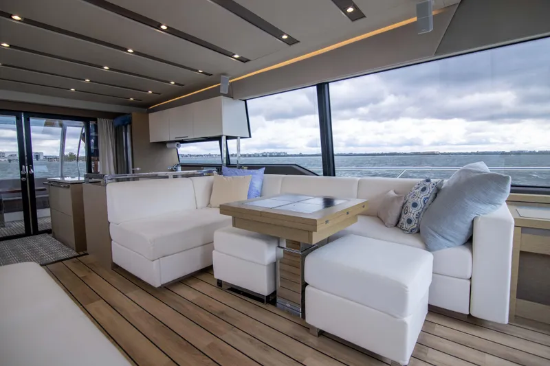 Slide: The Image of Luxurious interior of 2018 Prestige 680 Flybridge yacht with elegant seating and ocean view. - 11