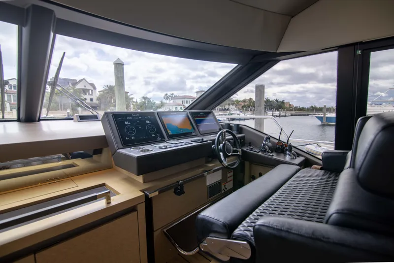 Slide: The Image of Interior helm of 2018 Prestige 680 Flybridge yacht with modern navigation equipment. - 16