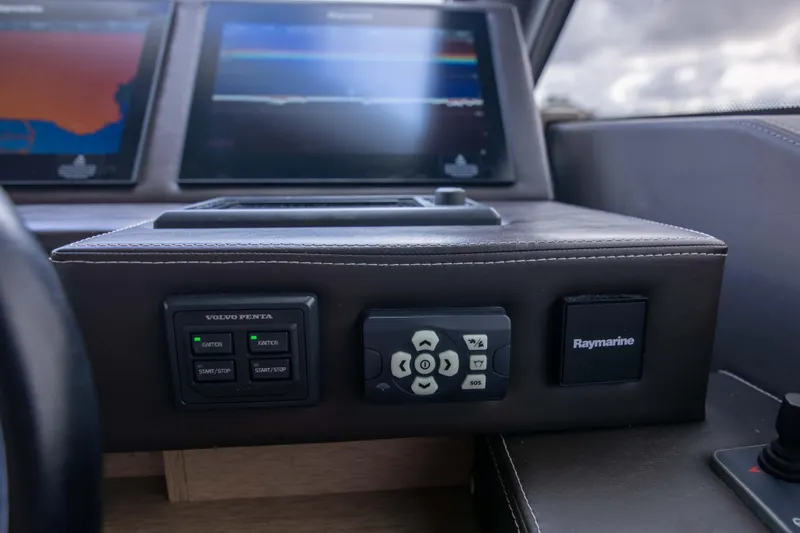 Slide: The Image of Control panel of 2018 Prestige 680 Flybridge yacht with navigation screens. - 18