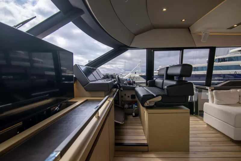 Slide: The Image of Luxurious interior of 2018 Prestige 680 Flybridge yacht with modern helm and seating. - 20