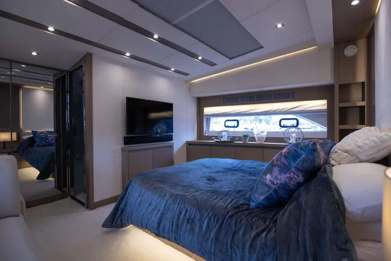 Slide: The Image of Luxurious bedroom interior of 2018 Prestige 680 Flybridge yacht with modern decor and ambient lighting. - 21