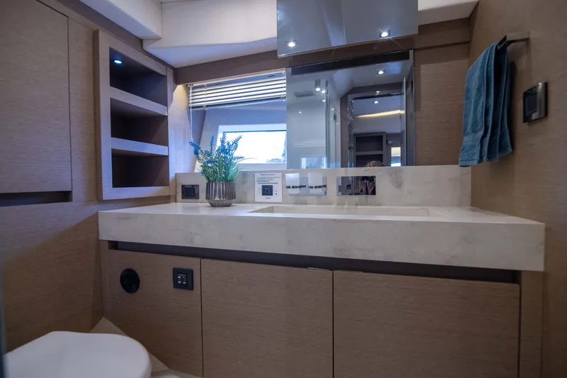 Slide: The Image of Luxurious bathroom interior of 2018 Prestige 680 Flybridge yacht with modern fixtures and decor. - 25