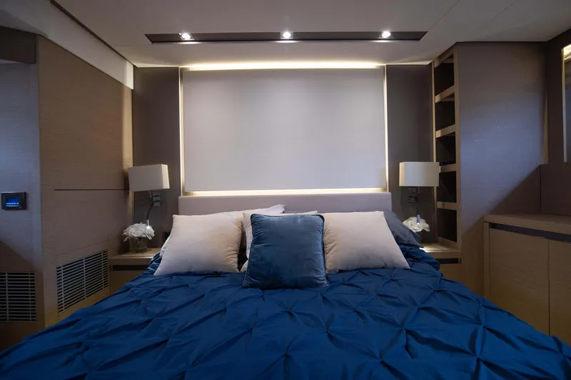 Slide: The Image of Luxurious bedroom interior of 2018 Prestige 680 Flybridge yacht with blue bedding. - 28
