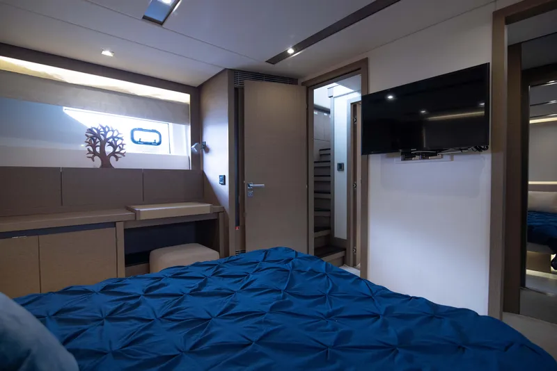 Slide: The Image of Luxurious bedroom interior of 2018 Prestige 680 Flybridge yacht with modern decor and TV. - 29