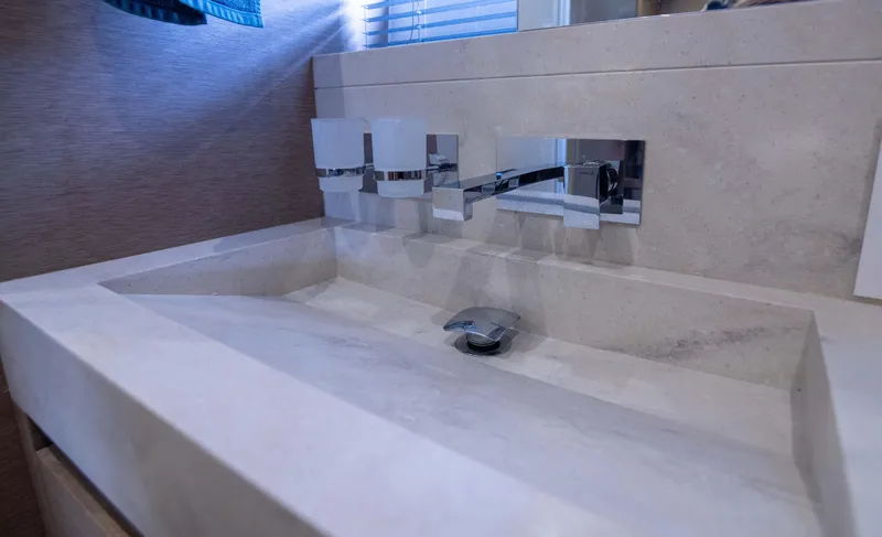 Slide: The Image of Modern bathroom sink on 2018 Prestige 680 Flybridge yacht, featuring sleek design and chrome fixtures. - 32