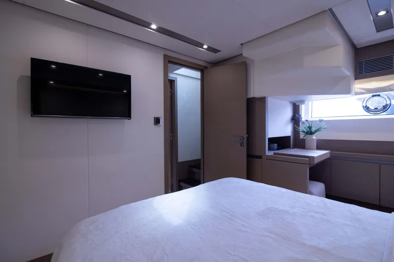Slide: The Image of Luxurious interior of 2018 Prestige 680 Flybridge yacht bedroom with modern decor and TV. - 35