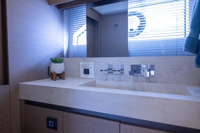 Slide: The Image of Luxurious bathroom interior of 2018 Prestige 680 Flybridge yacht with modern sink and decor. - 36
