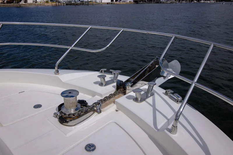 Slide: The Image of Bow of 2018 Prestige 680 Flybridge yacht with anchor and railing. - 43