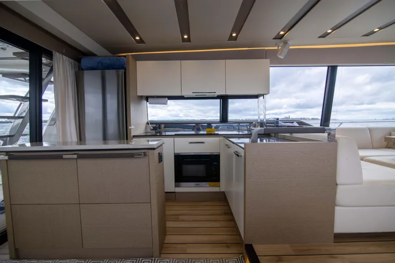 Slide: The Image of Modern kitchen interior on 2018 Prestige 680 Flybridge yacht with sleek design and ocean view. - 6