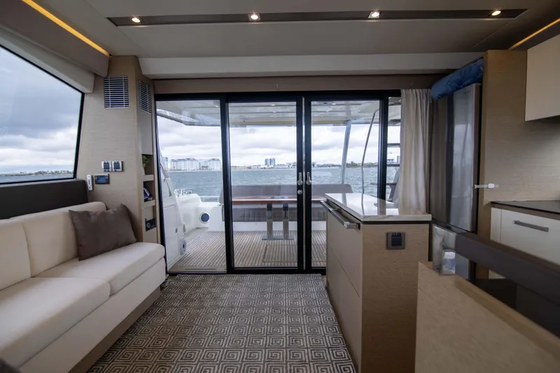 Slide: The Image of Luxurious interior of 2018 Prestige 680 Flybridge yacht with ocean view. - 9