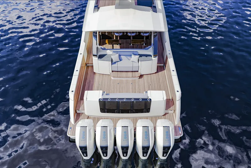 Slide: The Image of 2025 Scout 670 LXS boat with five powerful outboard engines on calm water. - 6