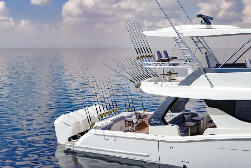 Slide: The Image of 2025 Scout 670 LXS boat on calm water with fishing rods and luxurious seating. - 9