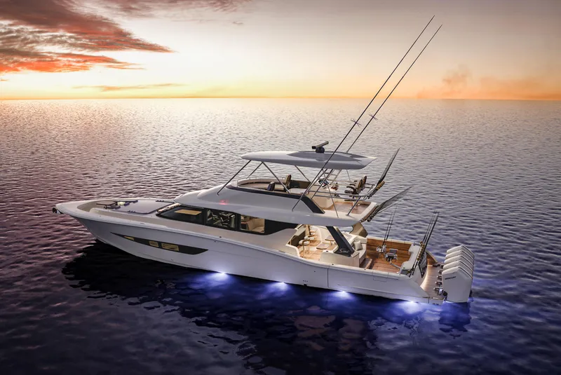 Slide: The Image of 2025 Scout 670 LXS yacht illuminated on ocean at sunset. - 7