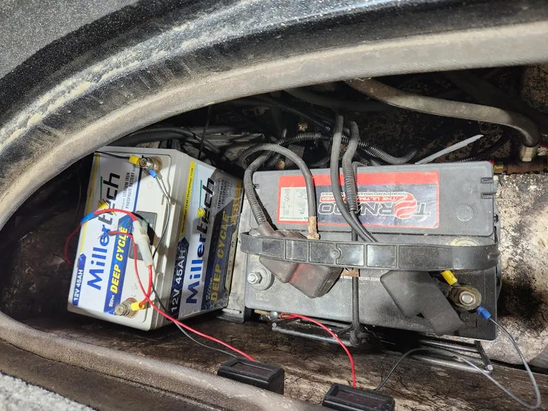 Slide: The Image of Batteries in a 1996 Cajun Master boat, featuring MillerTech deep cycle and Interstate models. - 10