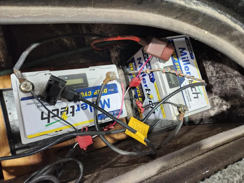 Slide: The Image of Two MillerTech batteries with cables in a Cajun Master 1996 compartment. - 11