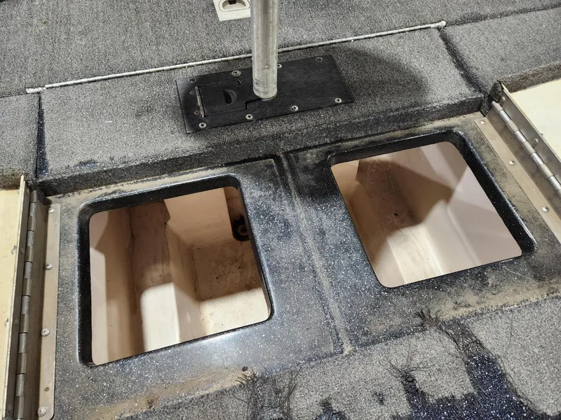 Slide: The Image of Cajun Master 1996 boat interior with open storage compartments. - 12