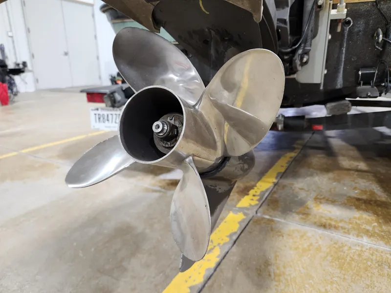 Slide: The Image of Close-up of a 1996 Cajun Master boat propeller in a garage setting. - 16