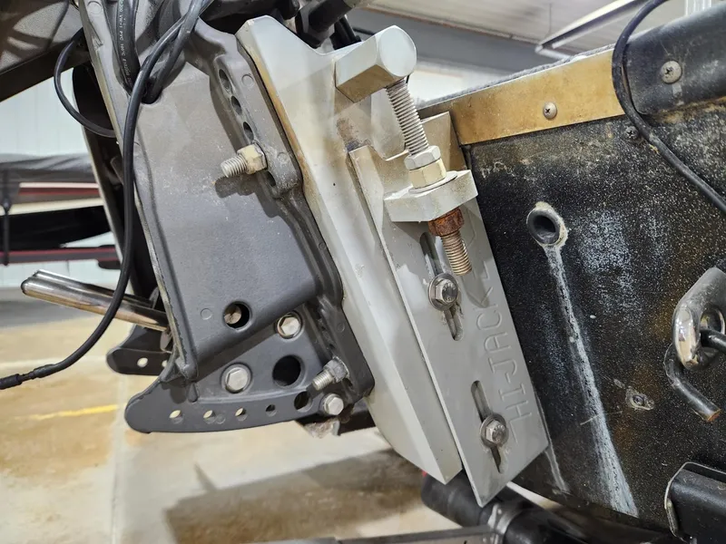 Slide: The Image of Close-up of a 1996 Cajun Master boat motor mount with visible bolts and metal components. - 17