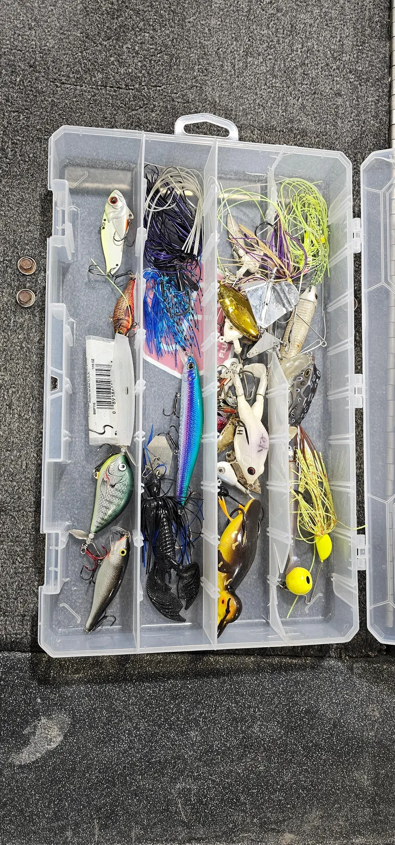 Slide: The Image of Tackle box with assorted fishing lures, Cajun Master 1996 model. - 19