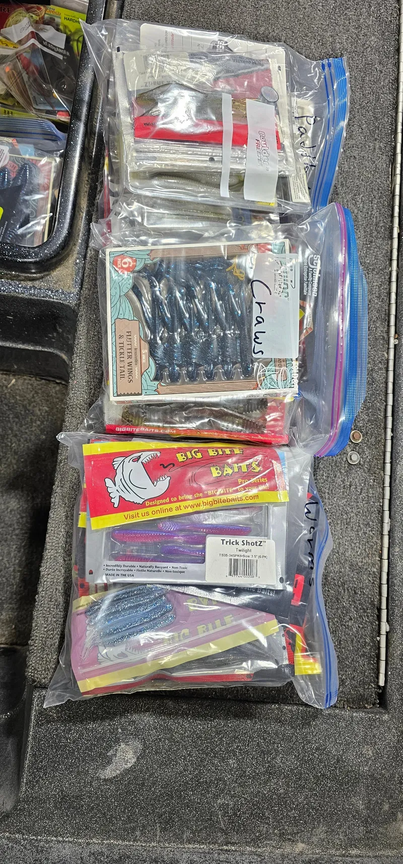 Slide: The Image of Plastic bags filled with assorted fishing lures on a Cajun Master boat, 1996 model. - 21