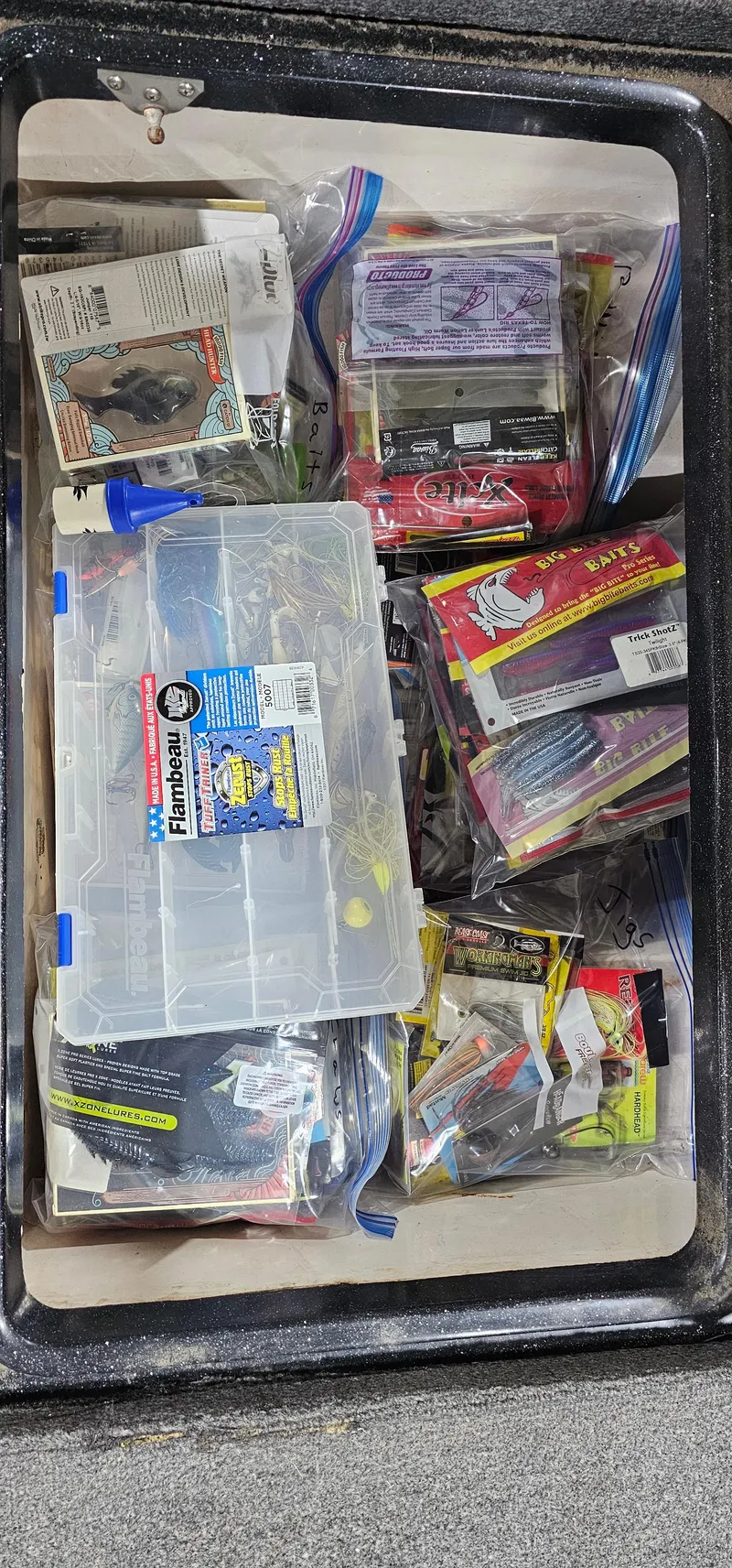 Slide: The Image of Tackle box filled with various fishing lures and accessories, Cajun Master 1996 model. - 22