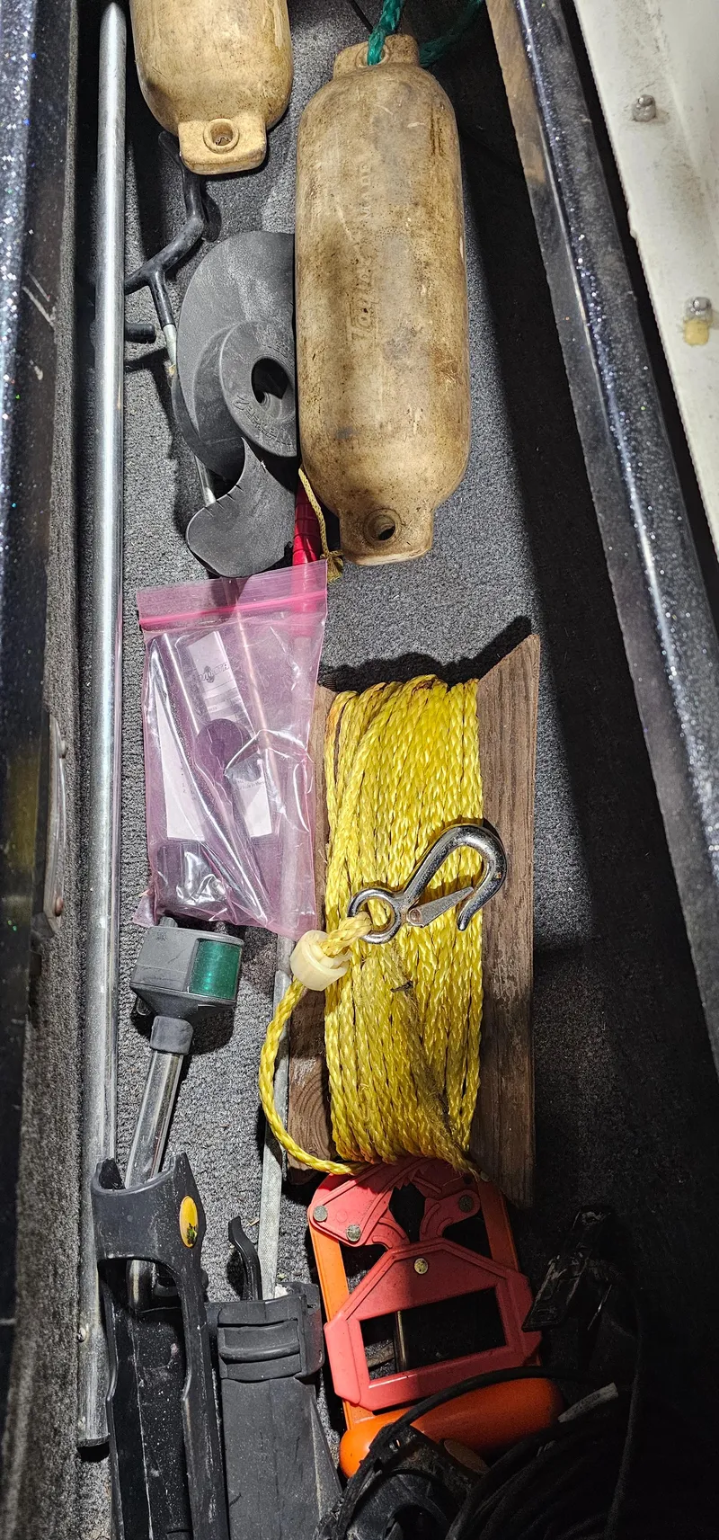 Slide: The Image of Boat storage compartment with tools, rope, and buoys; Cajun Master 1996 model. - 23