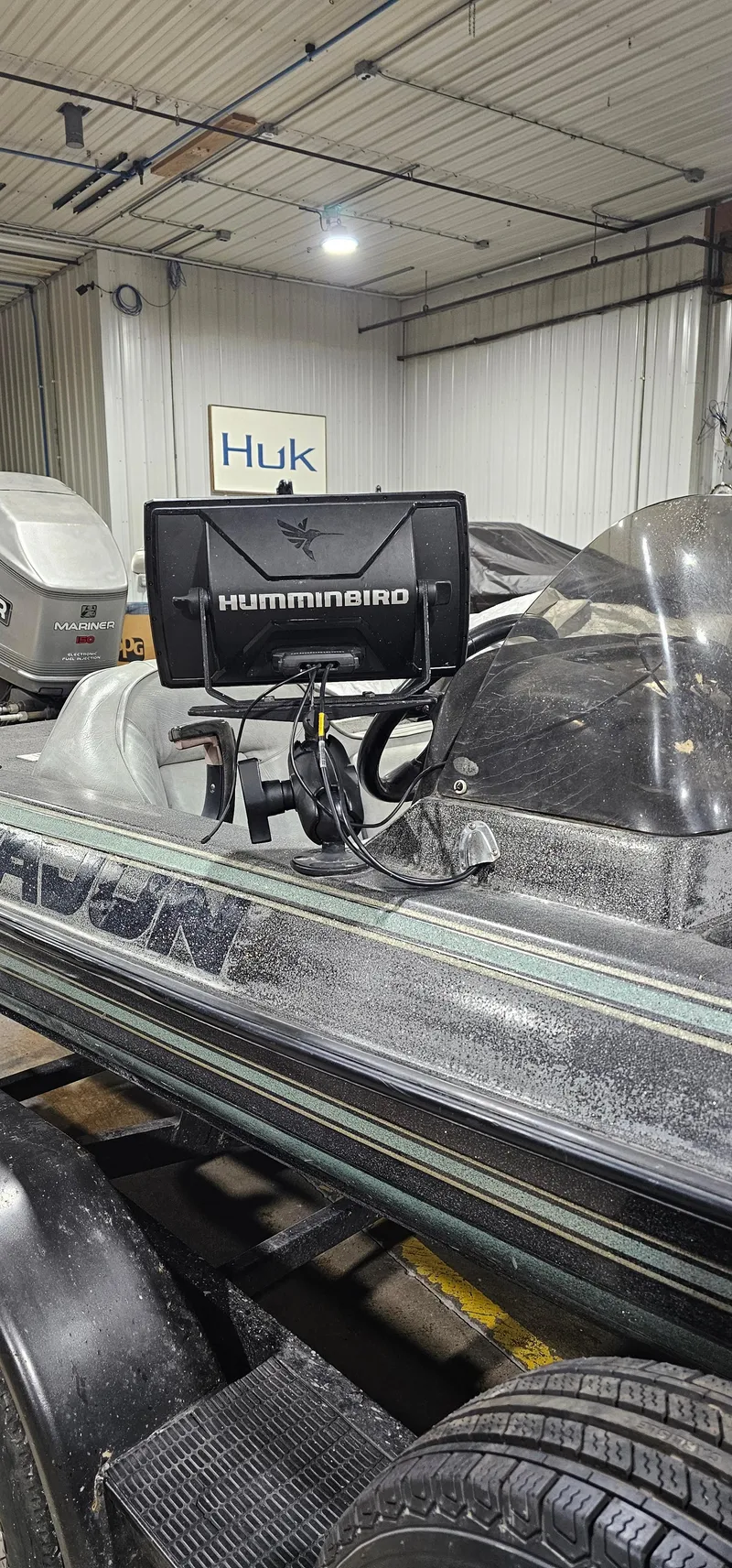 Slide: The Image of 1996 Cajun Master boat with Humminbird fish finder in a garage. - 27