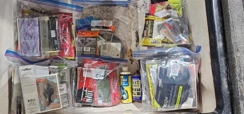 Slide: The Image of Assorted fishing tackle and supplies in plastic bags, Cajun Master 1996 model. - 29