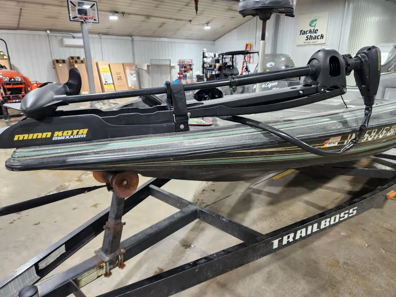 Slide: The Image of 1996 Cajun Master boat on Trailboss trailer with Minn Kota trolling motor in garage. - 6